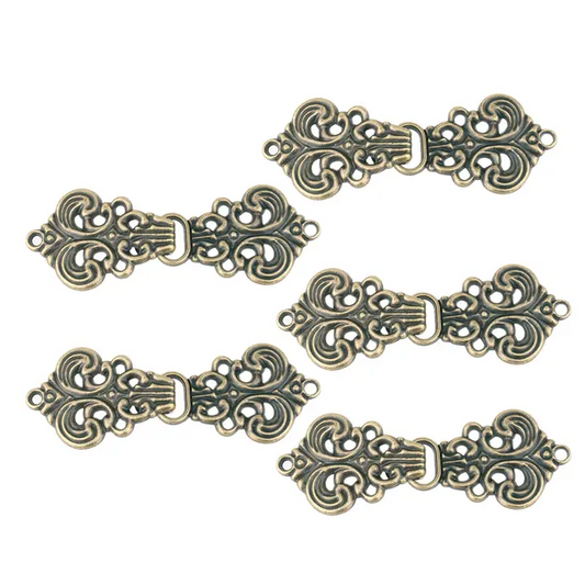 Dräktspänne, metall