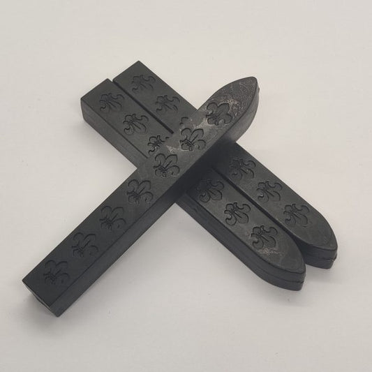 Sigillstämpel och två vax